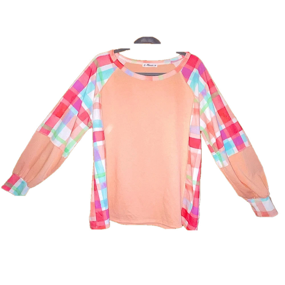 Pastel sweater with colorful plaid sleeves
